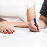 Unmarried couple reviewing a cohabitation agreement with a California family law attorney